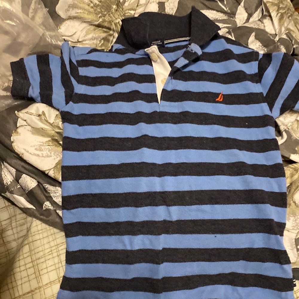 It is a stripe blue nautical polo shirt